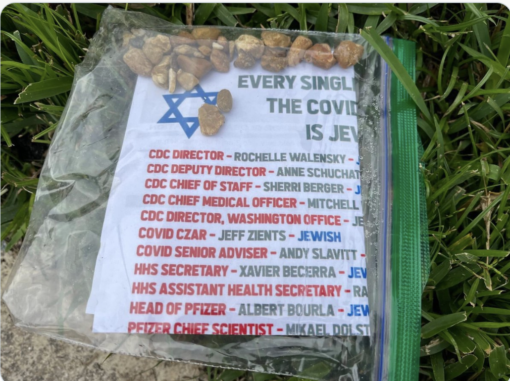 GDL COVID flyer in plastic bag on grass